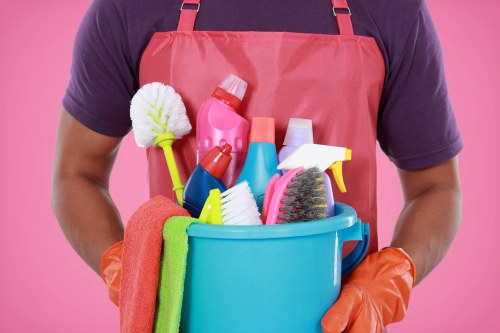 Airbnb cleaner preparing a Shoreditch short-let living room for new guests