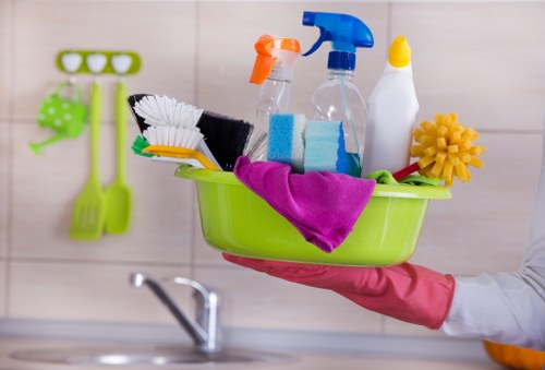 Detailed builders cleaning in a Shoreditch kitchen after renovation work